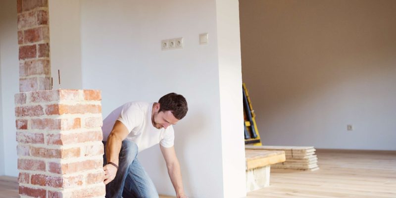 construction worker measuring floor
