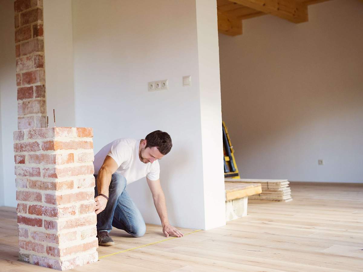 construction worker measuring floor