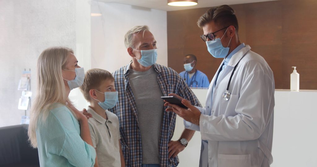 Doctor addressing family in waiting room_2560x1350