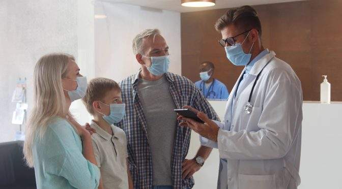 doctor and family in face masks