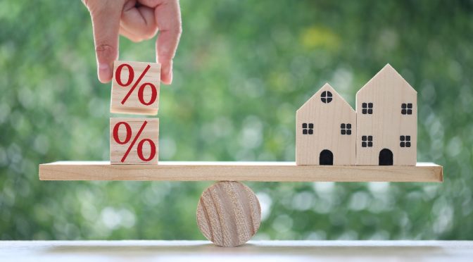 percentages balancing houses on seesaw