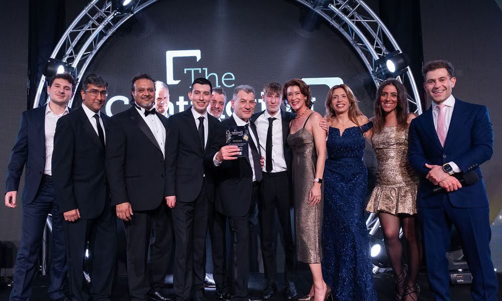 Contracting-Awards-2025_John-and-team-collecting-award